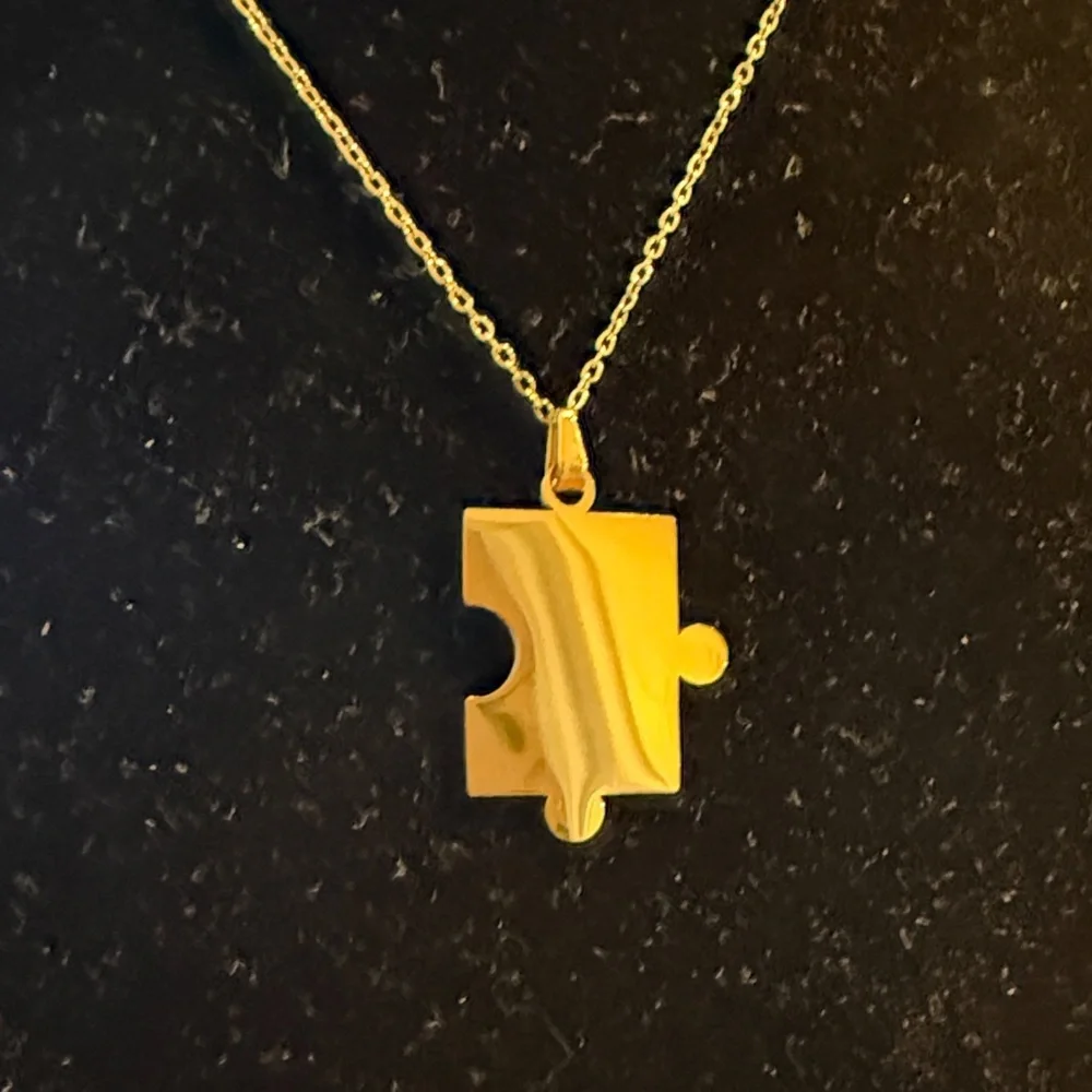 Plunder Gold Colored Puzzle Piece Necklace